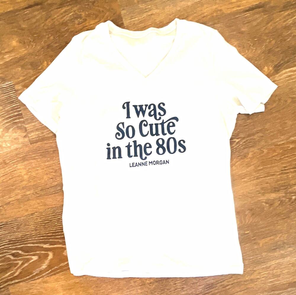 Leanne Morgan Men’s White V-Neck Graphic Tee “I Was So Cute in the 80s”
